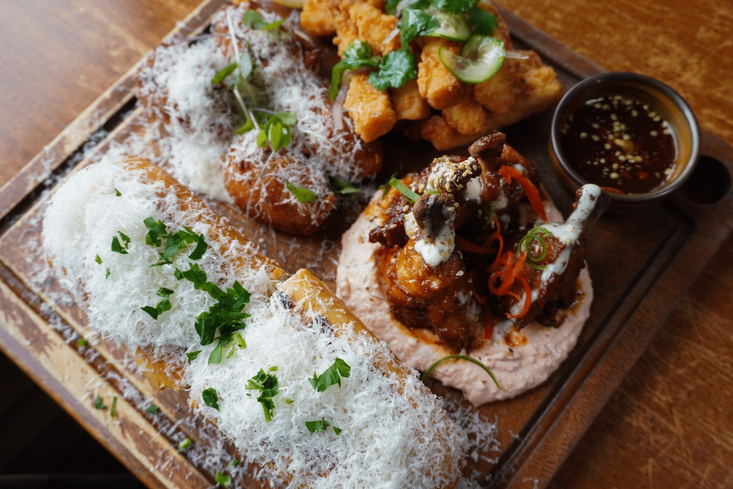 Share board with parmesan garlic bread, chicken lollipops, salt-and-pepper bites and dipping sauce